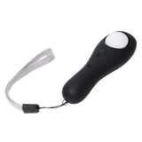 Un clicker de dressage pour chien de couleur noir avec un bouton blanc et un sangle en nylon pour sécurité